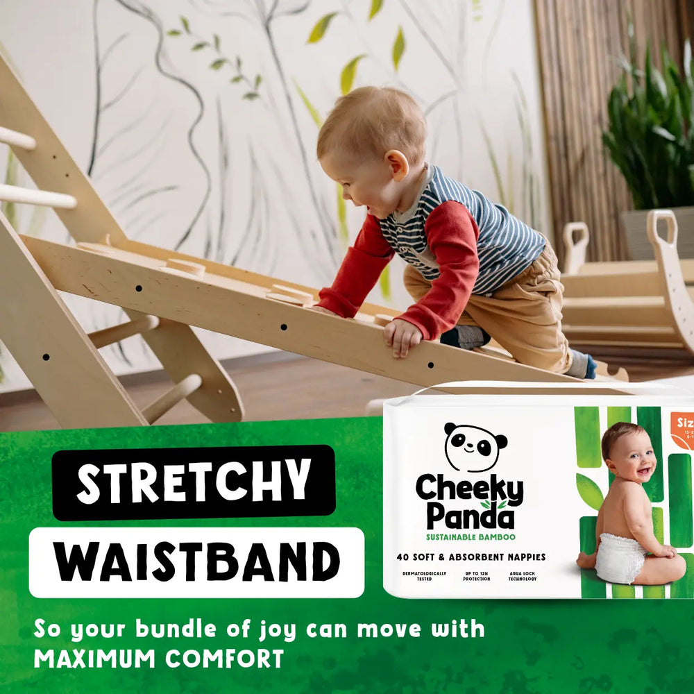 Child playing on a wooden climbing toy with Cheeky Panda nappies advertisement in the foreground.