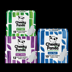 Three boxes of Cheeky Panda sustainable bamboo period pads on a white background