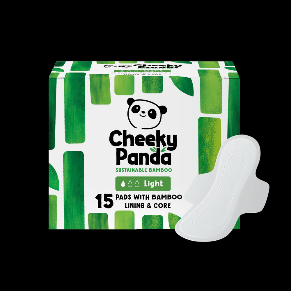 Cheeky Panda sustainable bamboo pads for light flow packaging with a white pad on a black background