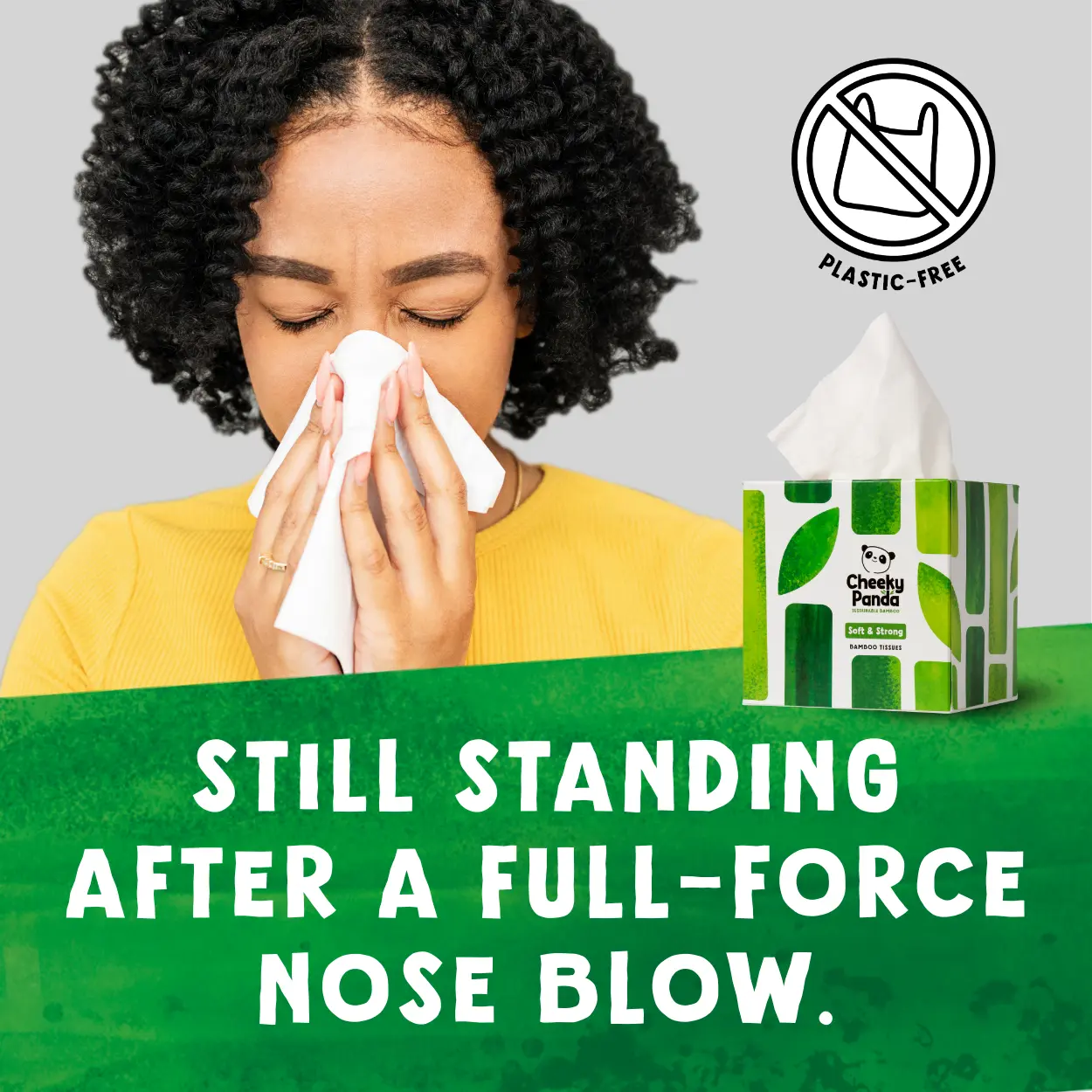 Person blowing their nose with tissues, Cheeky Panda box of tissues in the corner, text 'Still standing after a full-force nose blow.'.