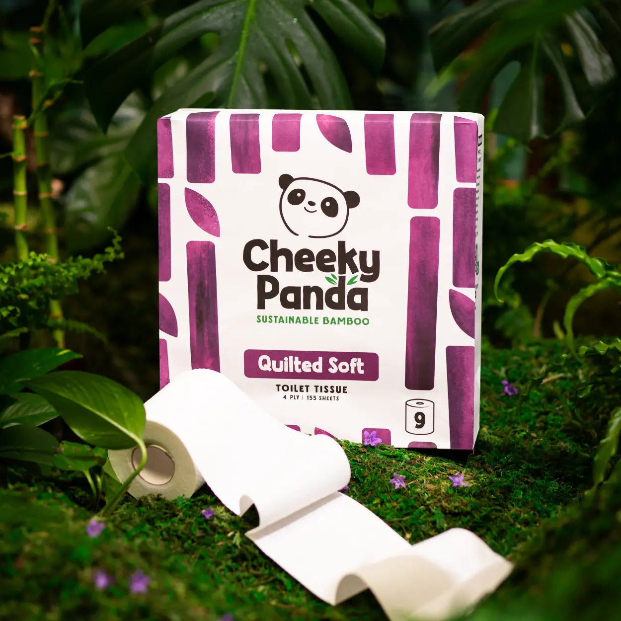 Cheeky Panda quilted toilet paper packaging with rolls on a green leafy background