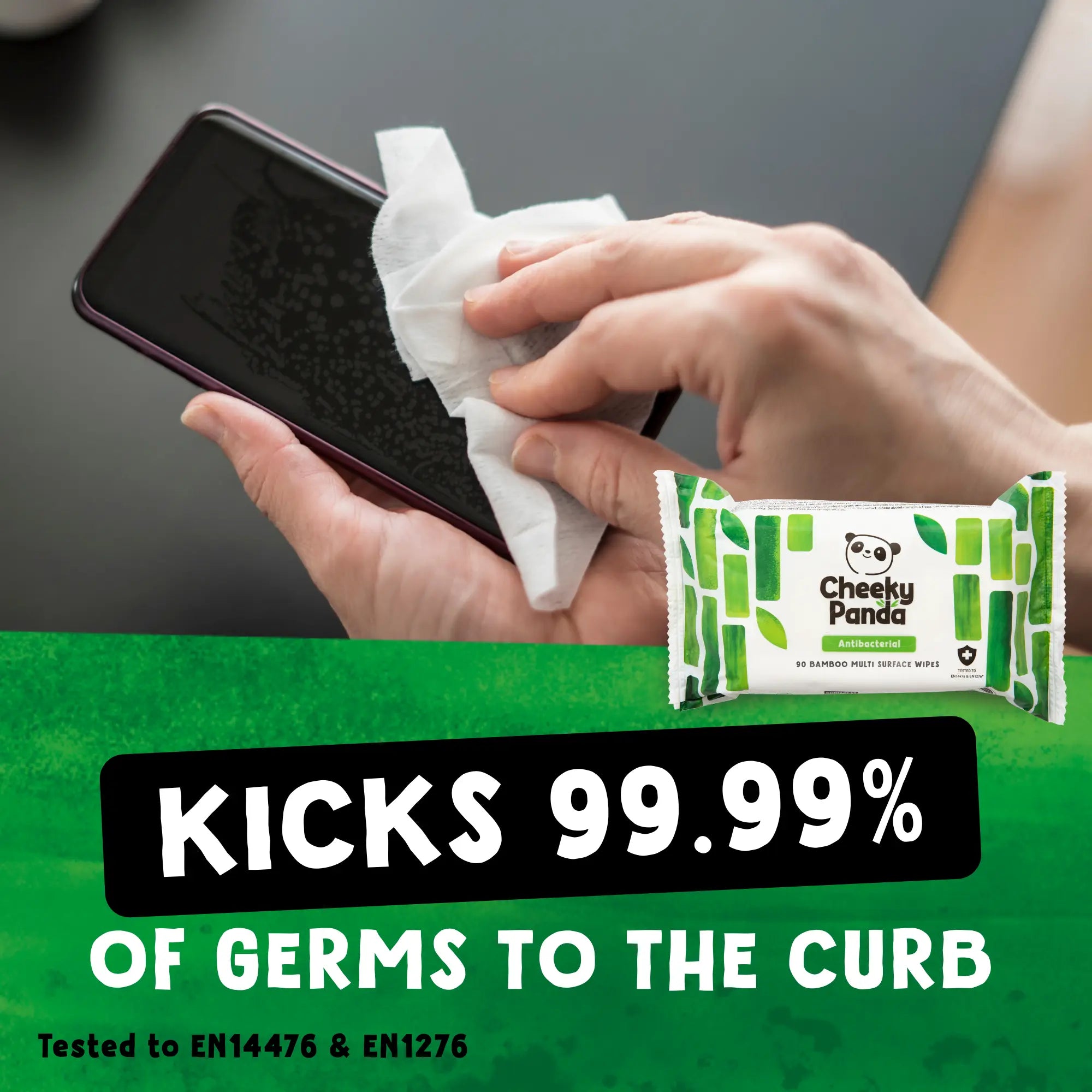 A hand cleaning a mobile phone screen with a Cheeky Panda antibacterial wipe.