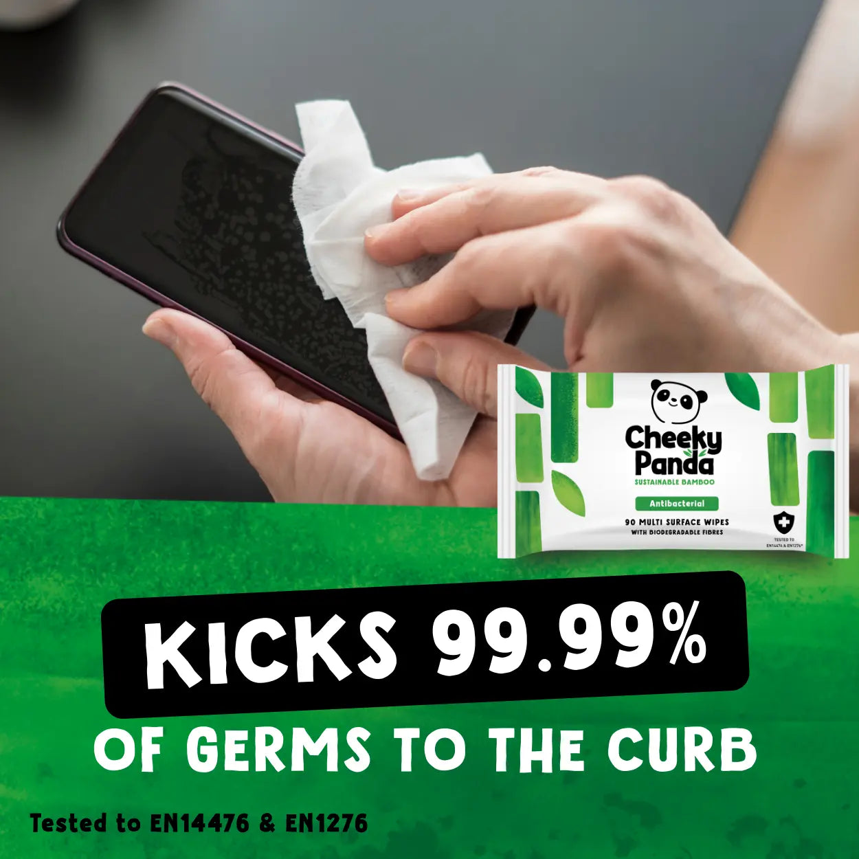 Person cleaning a phone with a Cheeky Panda antibacterial wipe, with product packaging visible.