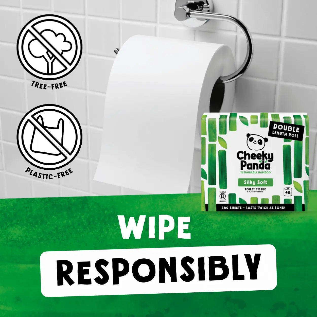 Cheeky Panda toilet paper with packaging on a bathroom wall, featuring tree-free and plastic-free icons.